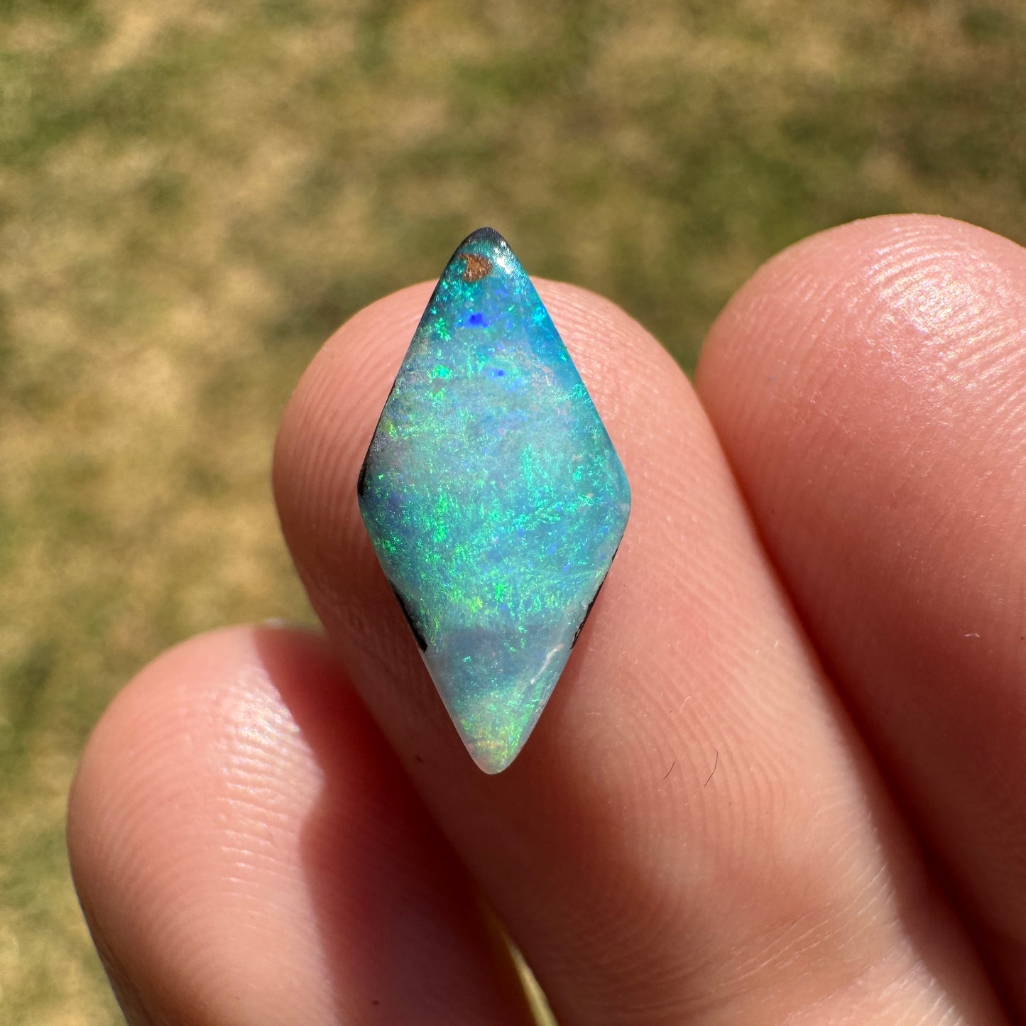 1.69 Ct small diamond shaped boulder opal