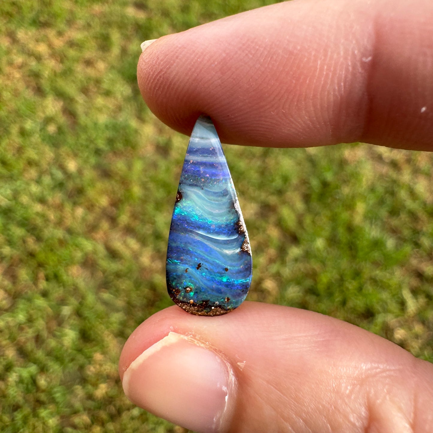 4.27 Ct stripy teardrop boulder opal.