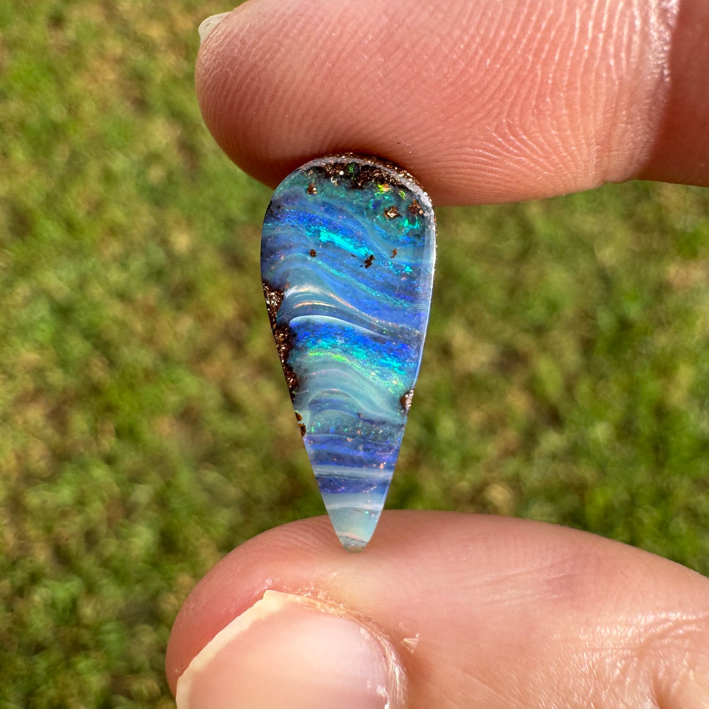 4.27 Ct stripy teardrop boulder opal.