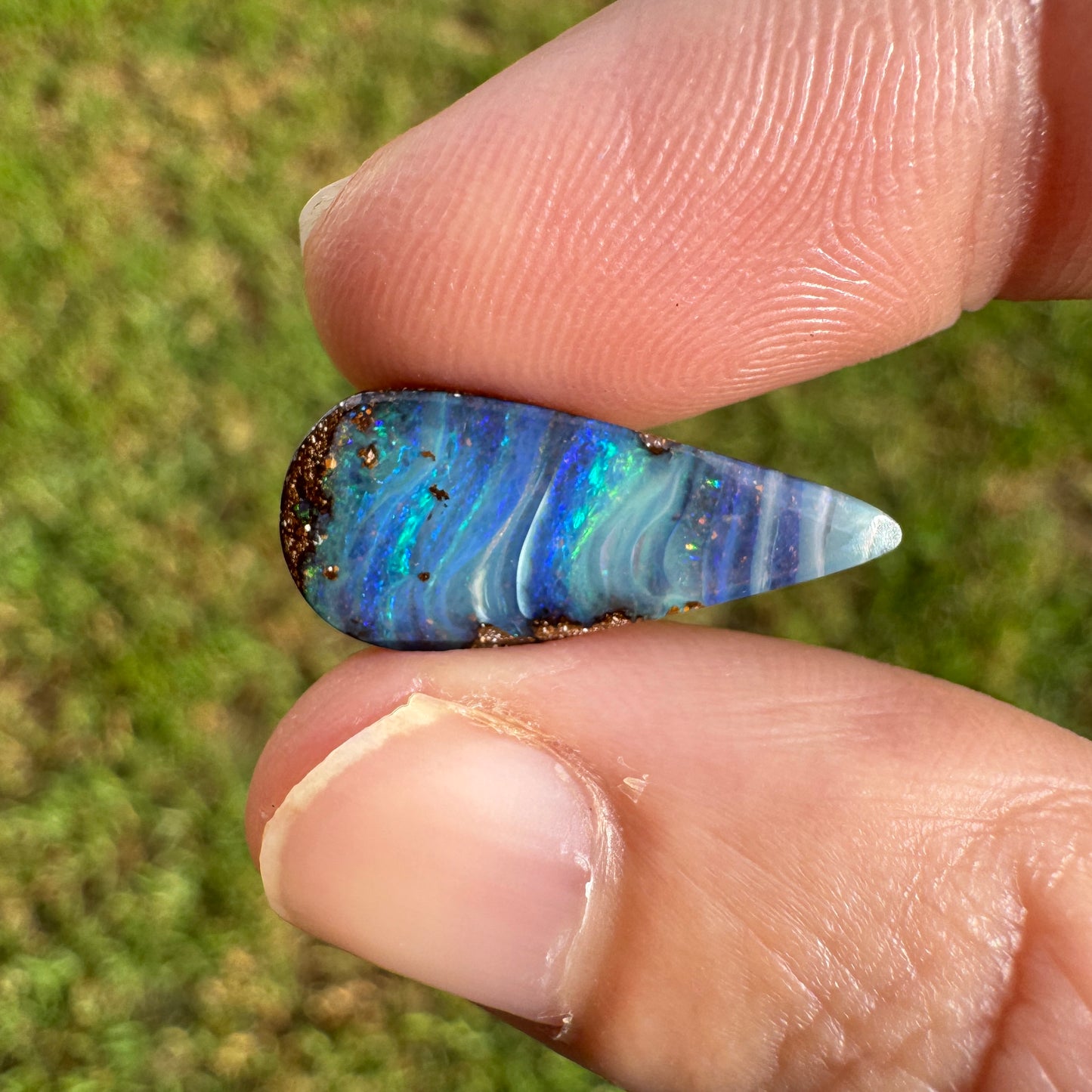 4.27 Ct stripy teardrop boulder opal.