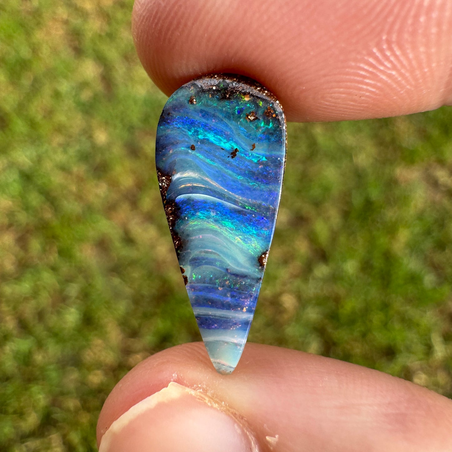 4.27 Ct stripy teardrop boulder opal.