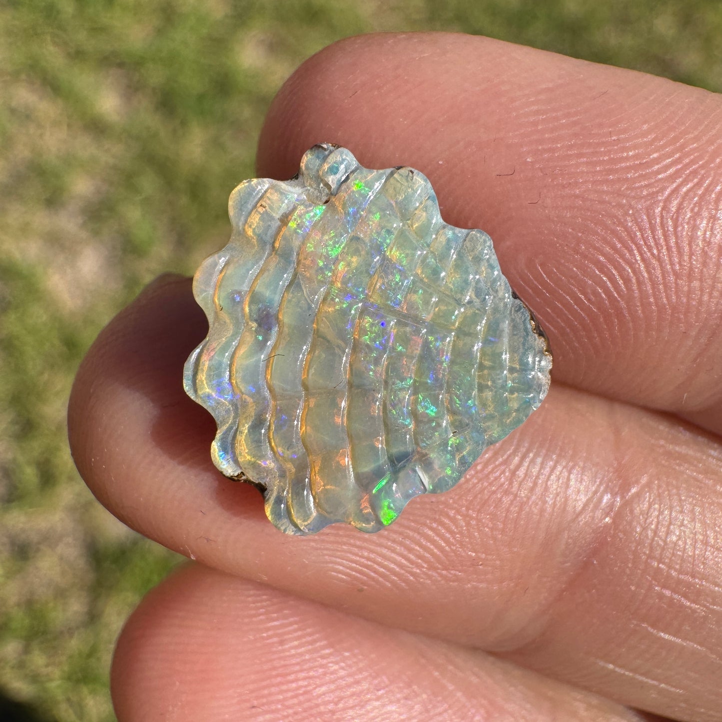 6.74 Ct shell boulder opal carving