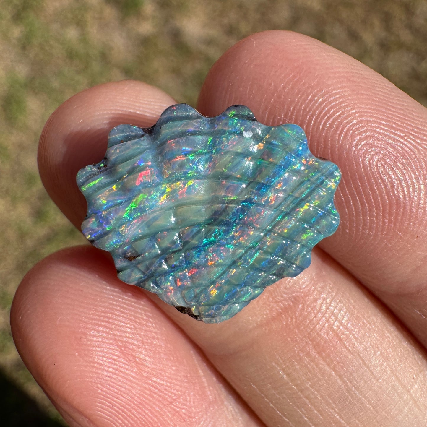 9.11 Ct gem-grade shell boulder opal carving