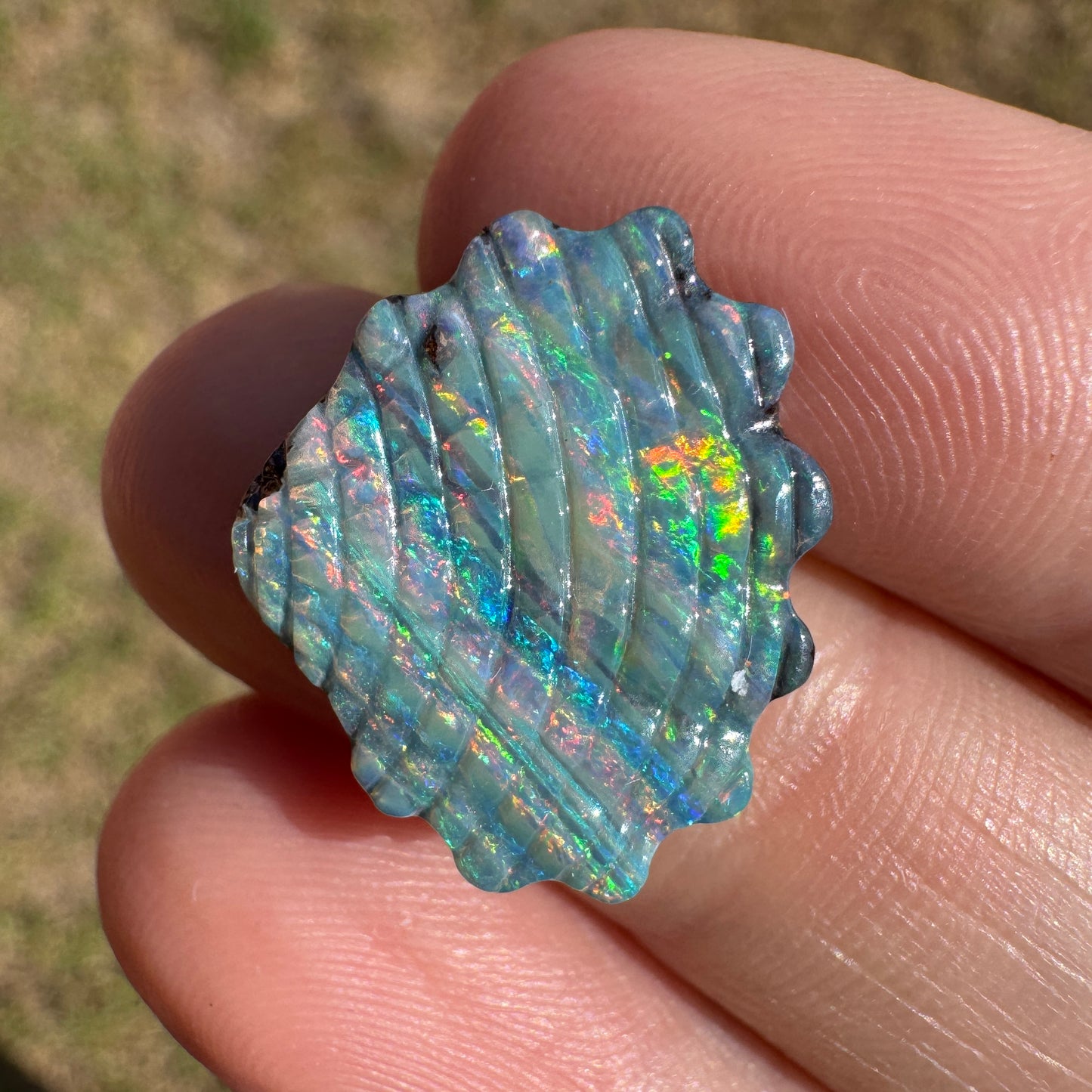 9.11 Ct gem-grade shell boulder opal carving