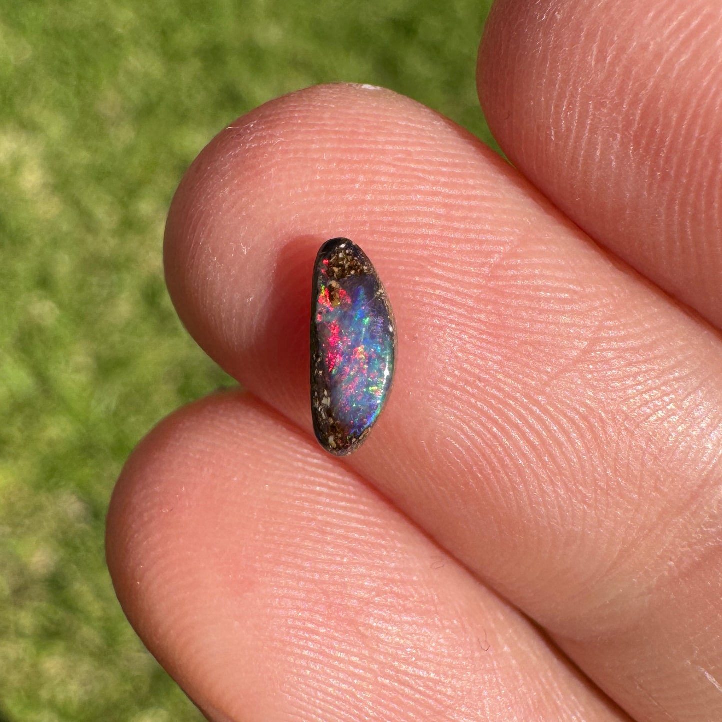 0.31 Ct extra small red boulder opal