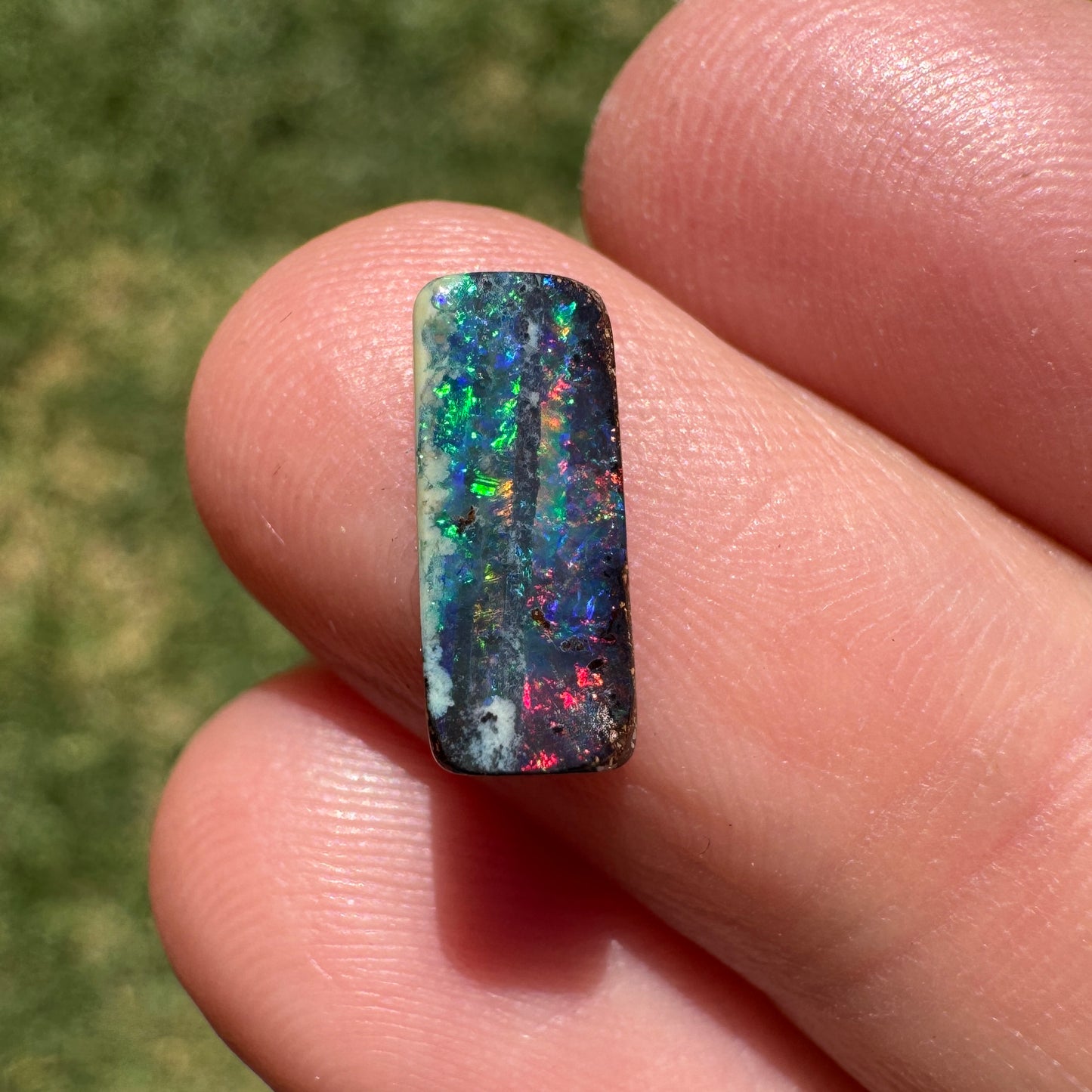 1.31 Ct red and green black gem boulder opal