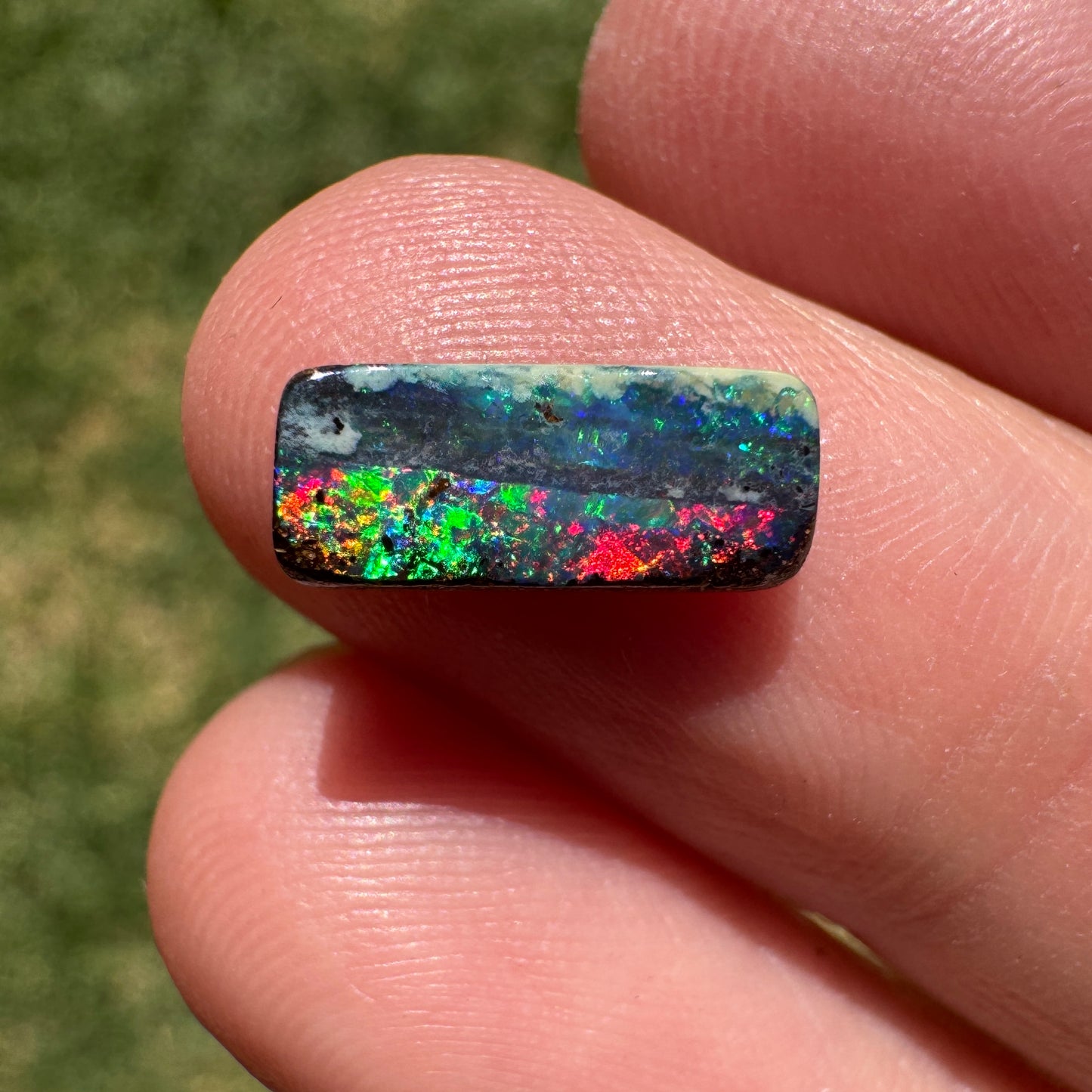 1.31 Ct red and green black gem boulder opal
