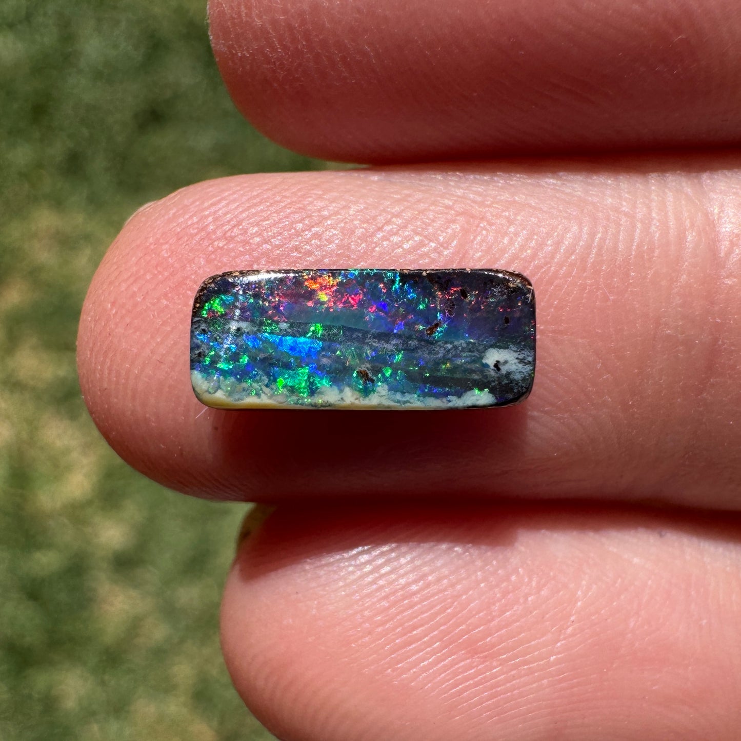 1.31 Ct red and green black gem boulder opal